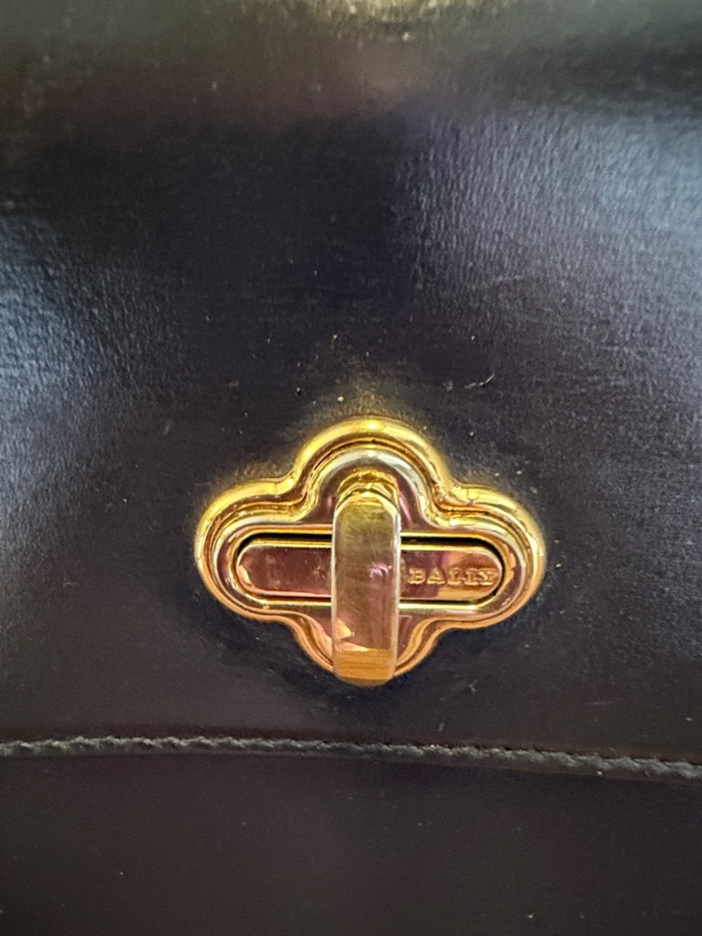 Vintage Bally black leather handbag with gold-tone turn-lock closure. - Picture 2 of 14